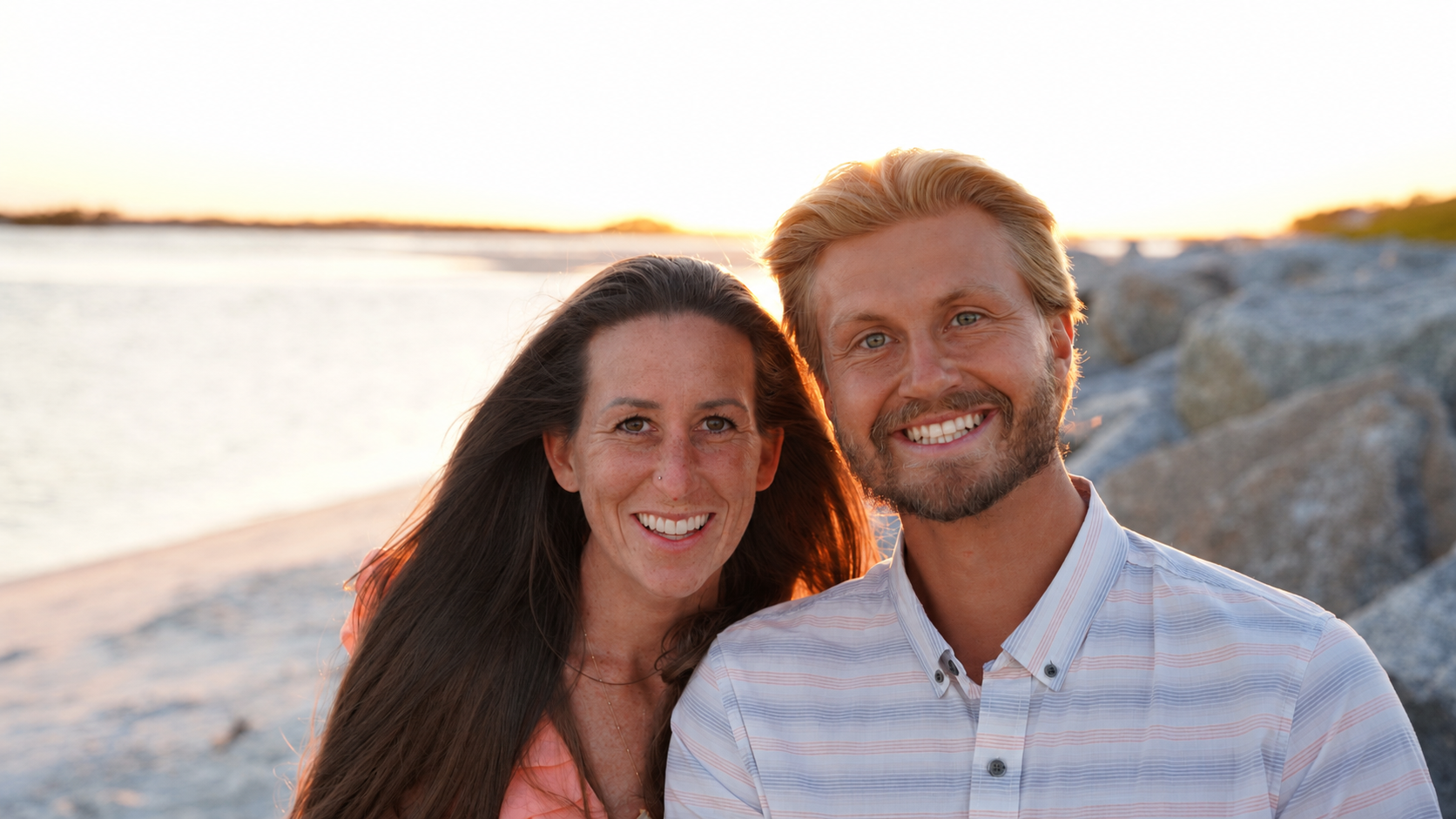 Laurie and Caleb Mobile standing together by the water